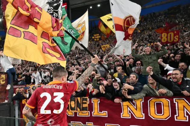 Roma's Italian defender #23 Gianluca Mancini celebrates with fans after winning the Italian Serie A football match between AS Roma and Lazio on April 6, 2024 at the Olympic stadium in Rome. (Photo by Alberto PIZZOLI / AFP) (Photo by ALBERTO PIZZOLI/AFP via Getty Images)