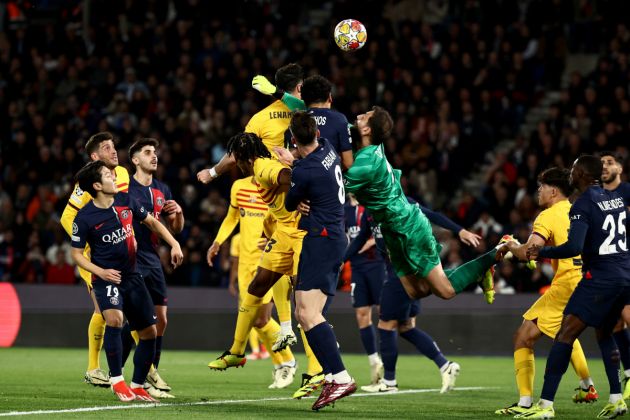 Paris Saint-Germain's Italian goalkeeper #99 Gianluigi Donnarumma (4R) attempts to punch the ball during the UEFA Champions League quarter final first leg football match between Paris Saint-Germain (PSG) and FC Barcelona at the Parc des Princes stadium in Paris on April 10, 2024. (Photo by Anne-Christine POUJOULAT / AFP) (Photo by ANNE-CHRISTINE POUJOULAT/AFP via Getty Images)