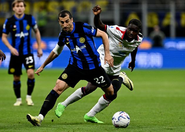 Inter Milan's Armenian midfielder #22 Henrikh Mkhitaryan fights for the ball with Cagliari's Angolan forward #77 Zito Luvumbo (R) during the Italian Serie A football match between Inter Milan and Cagliari at San Siro Stadium in Milan, on April 14, 2024. (Photo by GABRIEL BOUYS / AFP) (Photo by GABRIEL BOUYS/AFP via Getty Images)