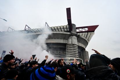 stadium Inter Milan's fans cheer as their team's bus arrives at San Siro Stadium prior to the Italian Serie A football match AC Milan vs Inter Milan in Milan, Italy on April 22, 2024 (Photo by Piero CRUCIATTI / AFP) (Photo by PIERO CRUCIATTI/AFP via Getty Images)