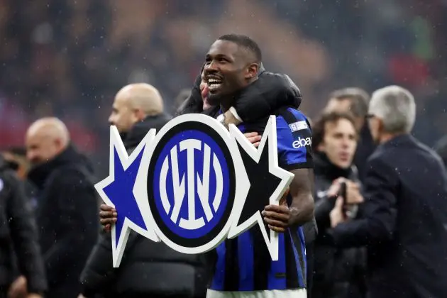 MILAN, ITALY - APRIL 22: Marcus Thuram of FC Inter celebrates winning the Serie A TIM title after winning the Serie A TIM match between AC Milan and FC Internazionale at Stadio Giuseppe Meazza on April 22, 2024 in Milan, Italy. (Photo by Marco Luzzani/Getty Images)