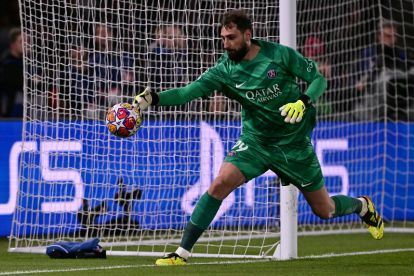 Paris Saint-Germain goalkeeper Gianluigi Donnarumma grabs the ball during the UEFA Champions League quarter final first leg football match between Paris Saint-Germain (PSG) and FC Barcelona at the Parc des Princes stadium in Paris on April 10, 2024. (Photo by Miguel MEDINA / AFP) (Photo by MIGUEL MEDINA/AFP via Getty Images)