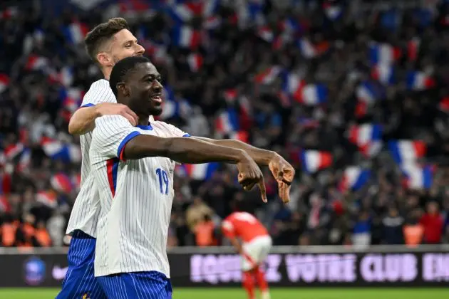 France midfielder Youssouf Fofana celebrates scoring his team's first goal with France and Milan forward Olivier Giroud during the friendly football match between France and Chile at the Stade Velodrome in Marseille, southern France, on March 26, 2024. (Photo by NICOLAS TUCAT / AFP) (Photo by NICOLAS TUCAT/AFP via Getty Images)