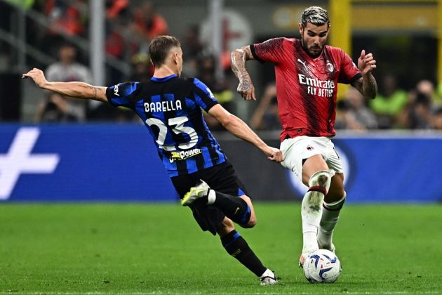 Inter midfielder Nicolo Barella fights for the ball with AC Milan defender Theo Hernandez (R) during the Italian Serie A football match between Inter Milan and AC Milan at the San Siro Stadium in Milan on September 16, 2023. (Photo by GABRIEL BOUYS / AFP) (Photo by GABRIEL BOUYS/AFP via Getty Images)
