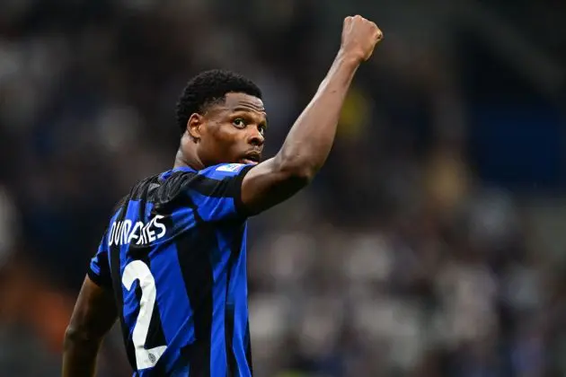 Inter defender Denzel Dumfries celebrates after scoring during the Italian Serie A football match between Inter Milan and Sassuolo at the San Siro stadium in Milan on September 27, 2023. (Photo by GABRIEL BOUYS / AFP) (Photo by GABRIEL BOUYS/AFP via Getty Images)