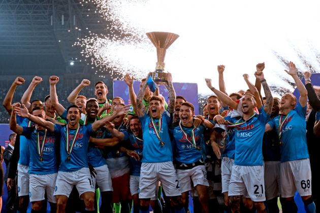 Napoli defender Giovanni Di Lorenzo (C) holds the Italian Scudetto Championship trophy as he and his teammates celebrate winning the 2023 Scudetto championship title on June 4, 2023, following the Italian Serie A football match between Napoli and Sampdoria at the Diego-Maradona stadium in Naples. (Photo by Ciro FUSCO / POOL / AFP) (Photo by CIRO FUSCO/POOL/AFP via Getty Images)