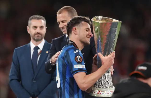 DUBLIN, IRELAND - MAY 22: Berat Djimsiti of Atalanta BC is embraced by Aleksander Ceferin, President of UEFA as he collects the UEFA Europa League trophy after the team's victory in the UEFA Europa League 2023/24 final match between Atalanta BC and Bayer 04 Leverkusen at Dublin Arena on May 22, 2024 in Dublin, Ireland. (Photo by Julian Finney/Getty Images)
