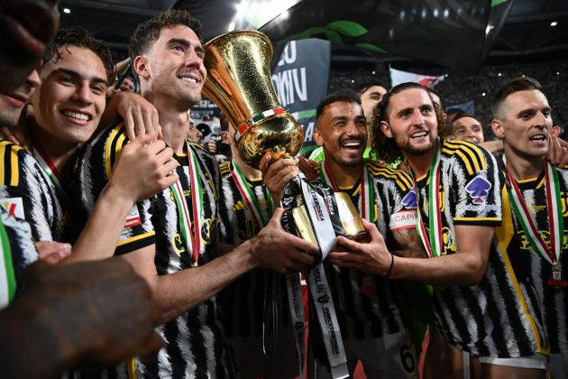 Coppa Italia Juventus' Serbian forward #09 Dusan Vlahovic (2ndL), Juventus' Brazilian defender #06 Danilo and Juventus' French midfielder #25 Adrien Rabiot pose with the trophy as Juventus players celebrate after winning the Italian Cup Final between Atalanta and Juventus at the Olympic stadium in Rome on May 15, 2024. (Photo by Isabella BONOTTO / AFP) (Photo by ISABELLA BONOTTO/AFP via Getty Images)