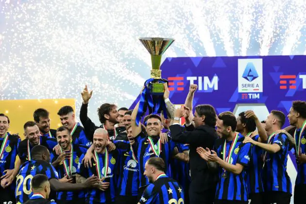 Inter Milan's Argentine forward #10 Lautaro Martinez lifts the trophy with teammates during a ceremony for the Italian Champions following the Italian Serie A football match between Inter Milan and Lazio in Milan, on May 19, 2024. Inter celebrates his 20th Scudetto. (Photo by Marco BERTORELLO / AFP) (Photo by MARCO BERTORELLO/AFP via Getty Images)