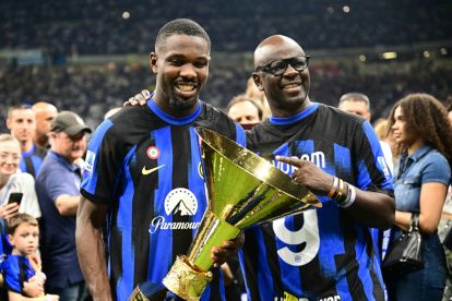 Inter Milan's French forward #09 Marcus Thuram (L) poses with his father French former international player Lilian Thuram during the trophy ceremony for the Italian Champions following the Italian Serie A football match between Inter Milan and Lazio in Milan, on May 19, 2024. Inter celebrates his 20th Scudetto. (Photo by Marco BERTORELLO / AFP) (Photo by MARCO BERTORELLO/AFP via Getty Images)