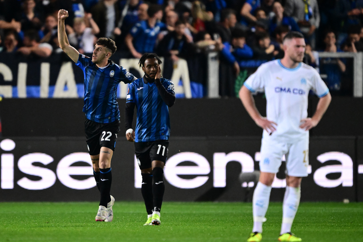 Atalanta's Italian defender #22 Matteo Ruggeri celebrates with Atalanta's Nigerian forward #11 Ademola Lookman after scoring during the UEFA Europa league second leg semi-final between Atalanta and Marseille at Bergamo's stadium on May 9, 2024. (Photo by Marco BERTORELLO / AFP) (Photo by MARCO BERTORELLO/AFP via Getty Images)