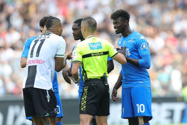 UDINE, ITALY - MAY 19: Saouza Silva Walace of Udinese Calcio, Marco Guida referee and M'Baye Niang of Empoli FC during the Serie A TIM match between Udinese Calcio and Empoli FC at Dacia Arena on May 19, 2024 in Udine, Italy.(Photo by Gabriele Maltinti/Getty Images)