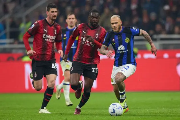 MILAN, ITALY - APRIL 22: Federico Dimarco of FC Inter is challenged by Fikayo Tomori of AC Milan during the Serie A TIM match between AC Milan and FC Internazionale at Stadio Giuseppe Meazza on April 22, 2024 in Milan, Italy. (Photo by Francesco Scaccianoce/Getty Images)