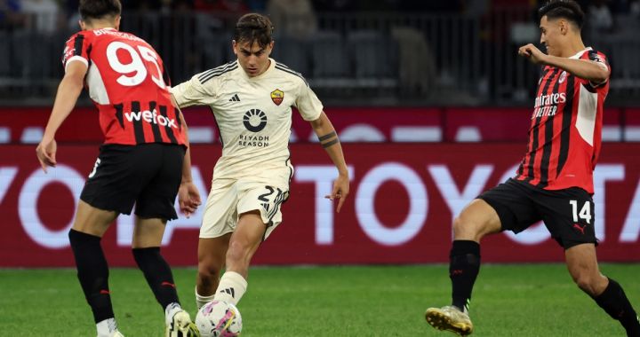 AS Roma forward Paulo Dybala takes control of the ball from AC Milan duo Tijjani Reijnders (R) and Davide Bartesaghi (L) during a friendly match between AC Milan and AS Roma at the Perth Rectangular Stadium in Perth on May 31, 2024. (Photo by COLIN MURTY / AFP) / -- IMAGE RESTRICTED TO EDITORIAL USE - STRICTLY NO COMMERCIAL USE -- (Photo by COLIN MURTY/AFP via Getty Images)