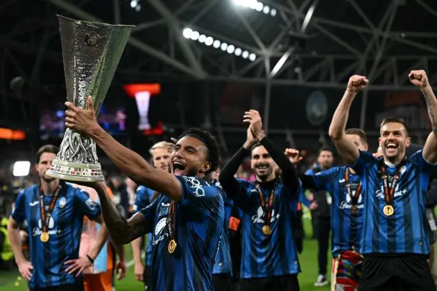 Tottenham target Ederson holds up the trophy as Atalanta's players celebrate after the UEFA Europa League final football match between Atalanta and Bayer Leverkusen at the Dublin Arena stadium, in Dublin, on May 22, 2024. Atalanta won the game 3-0. (Photo by Paul ELLIS / AFP) (Photo by PAUL ELLIS/AFP via Getty Images)