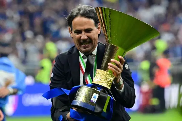 Inter Milan coach Simone Inzaghi holds the trophy during the ceremony for the Italian Champions following the Italian Serie A football match between Inter Milan and Lazio in Milan, on May 19, 2024. Inter celebrates his 20th Scudetto. (Photo by Marco BERTORELLO / AFP) (Photo by MARCO BERTORELLO/AFP via Getty Images)