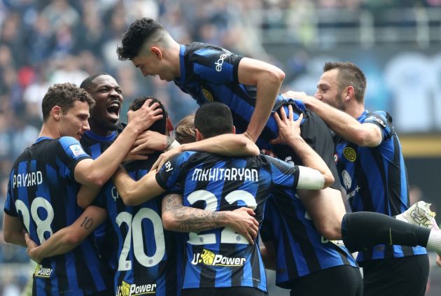 MILAN, ITALY - APRIL 28: Hakan Calhanoglu of ea FC Inter celebrates with his teammates after scoring his team's second goal during the Serie A TIM match between FC Internazionale and Torino FC at Stadio Giuseppe Meazza on April 28, 2024 in Milan, Italy. (Photo by Marco Luzzani/Getty Images)