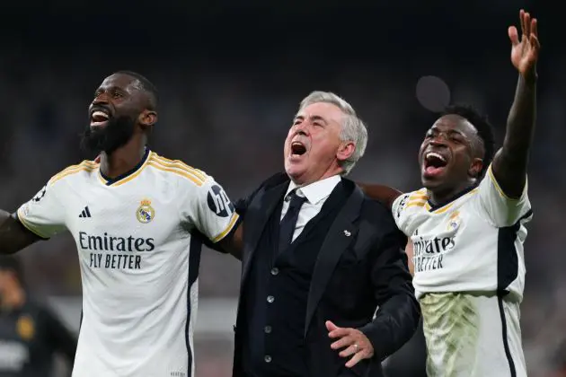 Carlo Ancelotti with Real Madrid players Antonio Rüdiger and Vinicius Jr. after the Champions League semi-final second leg against Bayern Munich.