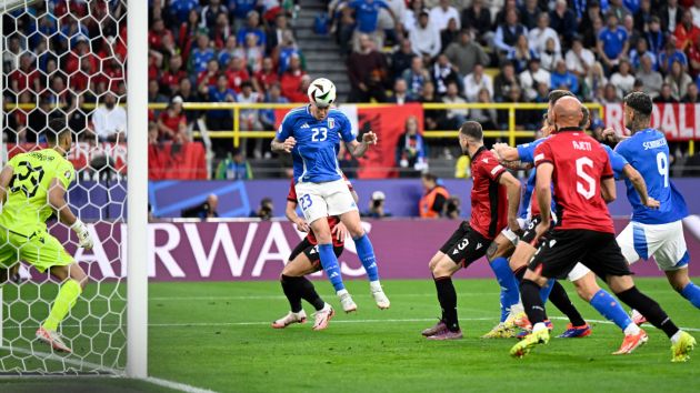 Italy's defender #23 Alessandro Bastoni heads the ball and scores his team's first goal during the UEFA Euro 2024 Group B football match between Italy and Albania at the BVB Stadion in Dortmund on June 15, 2024. (Photo by INA FASSBENDER / AFP) (Photo by INA FASSBENDER/AFP via Getty Images)