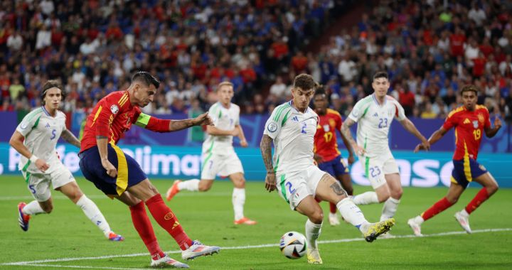 GELSENKIRCHEN, GERMANY - JUNE 20: Alvaro Morata of Spain shoots whilst under pressure from Giovanni Di Lorenzo of Italy during the UEFA EURO 2024 group stage match between Spain and Italy at Arena AufSchalke on June 20, 2024 in Gelsenkirchen, Germany. (Photo by Lars Baron/Getty Images)