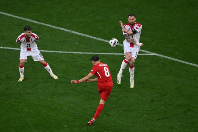 TOPSHOT - Turkey's forward #08 Arda Guler scores his team's second goal during the UEFA Euro 2024 Group F football match between Turkey and Georgia at the BVB Stadion in Dortmund on June 18, 2024. (Photo by OZAN KOSE / AFP) (Photo by OZAN KOSE/AFP via Getty Images)