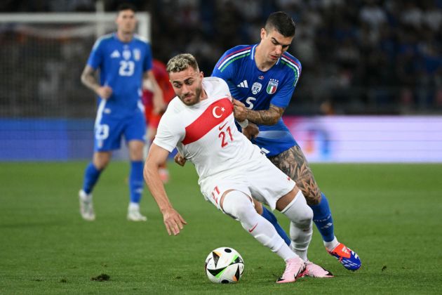 Italy's defender #05 Gianluca Mancini (R) fights for the ball with Turkey's defender #21 Baris Alper Yilmaz during the international friendly football match between Italy and Turkey as part of their preparation for the UEFA Euro 2024 European football championships, at the Dall'Ara Stadium on June 4, 2024 in Bologna. (Photo by Alberto PIZZOLI / AFP) (Photo by ALBERTO PIZZOLI/AFP via Getty Images)