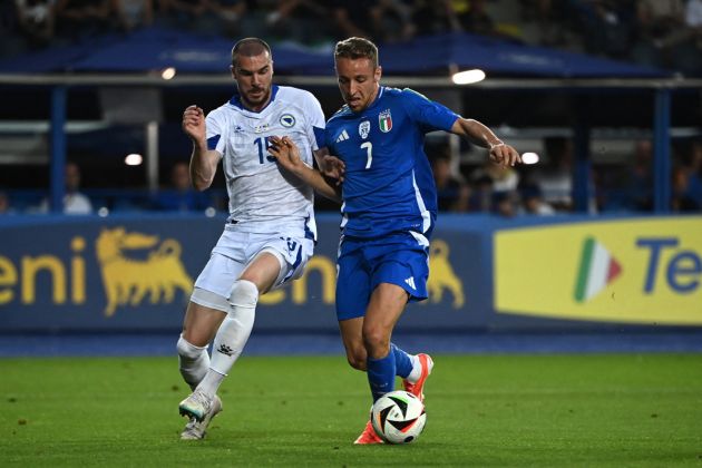 Italy's midfielder #07 Davide Frattesi fights for the ball with Bosnia-Herzegovina's defender #15 Nihad Mujakic during the International friendly football match between Italy and Bosnia-Herzegovina in Empoli on June 09, 2024. (Photo by Isabella BONOTTO / AFP) (Photo by ISABELLA BONOTTO/AFP via Getty Images)