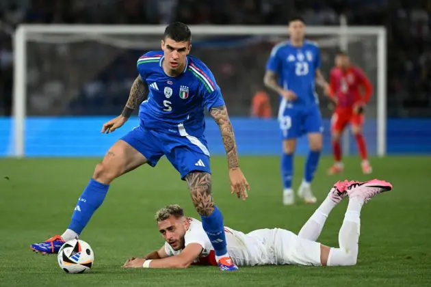 Italy's defender #05 Gianluca Mancini fights for the ball with Turkey's defender #21 Baris Alper Yilmaz during the international friendly football match between Italy and Turkey as part of their preparation for the UEFA Euro 2024 European football championships, at the Dall'Ara Stadium on June 4, 2024 in Bologna. (Photo by Alberto PIZZOLI / AFP) (Photo by ALBERTO PIZZOLI/AFP via Getty Images)