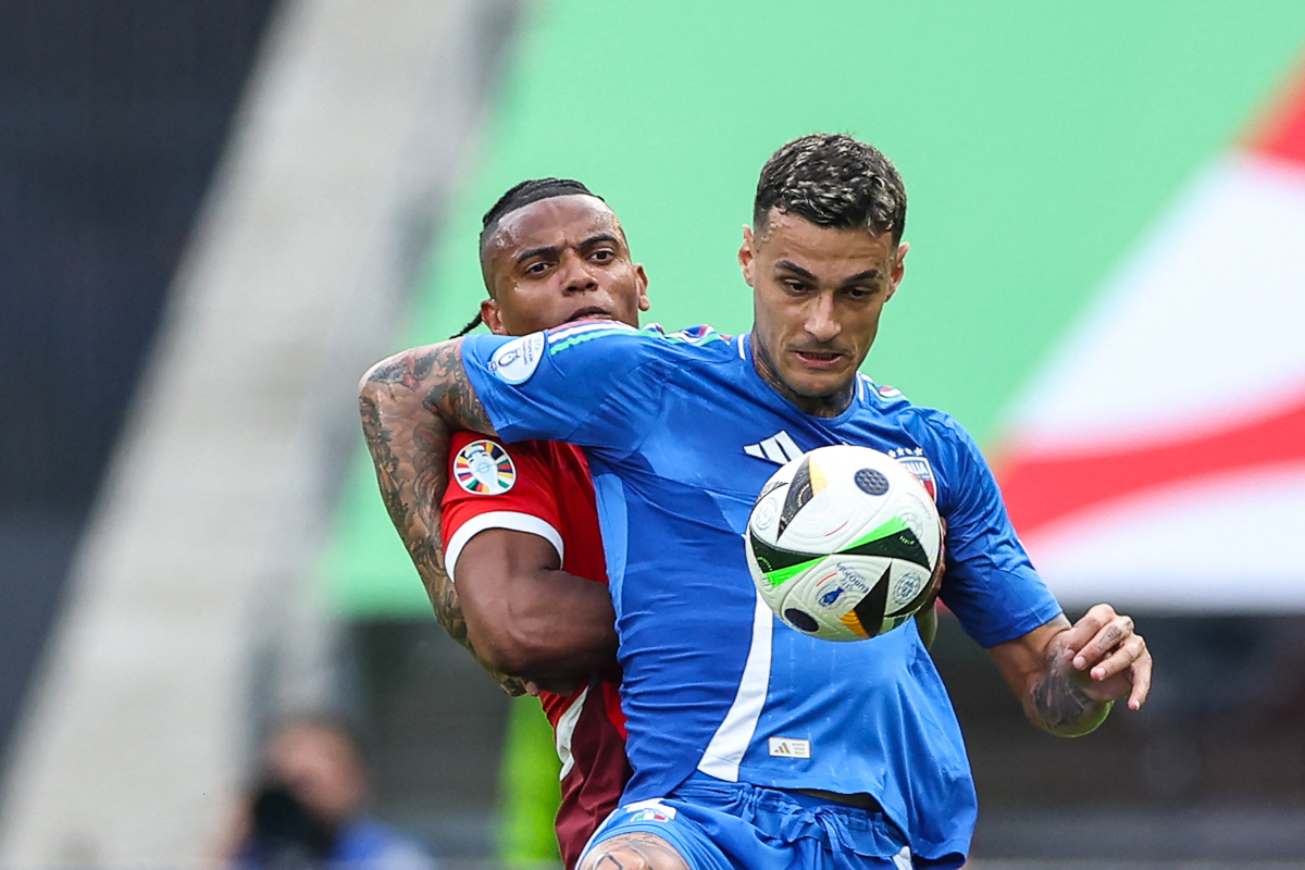 Italy's forward #09 Gianluca Scamacca (R) fights for the ball with Switzerland's defender #05 Manuel Akanji during the UEFA Euro 2024 round of 16 football match between Switzerland and Italy at the Olympiastadion Berlin in Berlin on June 29, 2024. (Photo by Ronny HARTMANN / AFP) (Photo by RONNY HARTMANN/AFP via Getty Images)