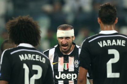 Juventus' defender Giorgio Chiellini (C) reacts during the UEFA Champions League semi-final first leg football match Juventus vs Real Madrid on May 5, 2015 at the Juventus stadium in Turin.     AFP PHOTO / MARCO BERTORELLO        (Photo credit should read MARCO BERTORELLO/AFP via Getty Images)