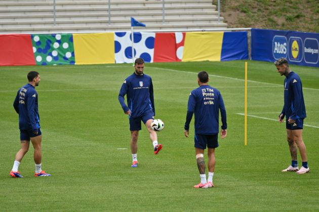 Italy's midfielder #16 Bryan Cristante (L), Italy's midfielder #10 Lorenzo Pellegrini (2L) and Italy's forward #9 Gianluca Scamacca (R) take part in a training sesssion of Italy's national football team ahead of the UEFA Euro 2024 football Championship in Iserlohn, on June 12, 2024. (Photo by Alberto PIZZOLI / AFP) (Photo by ALBERTO PIZZOLI/AFP via Getty Images)