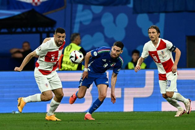 Croatia's midfielder #08 Mateo Kovacic, Italy's midfielder #08 Jorginho and Croatia's midfielder #10 Luka Modric fighr for the ball during the UEFA Euro 2024 Group B football match between Croatia and Italy at the Leipzig Stadium in Leipzig on June 24, 2024. (Photo by GABRIEL BOUYS / AFP) (Photo by GABRIEL BOUYS/AFP via Getty Images)