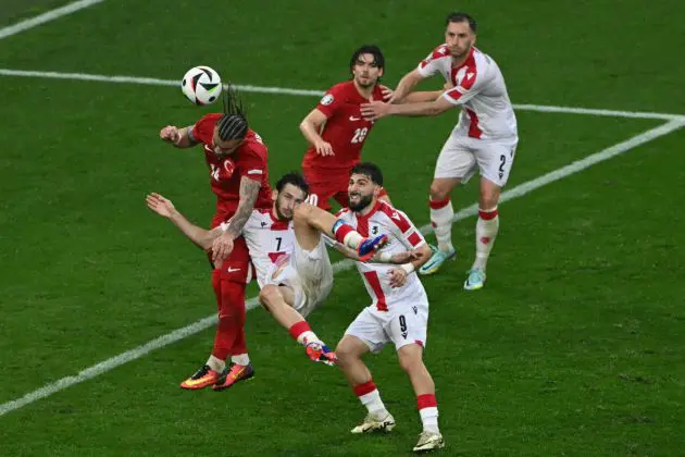 Turkey's defender #14 Abdulkerim Bardakci heads the ball past Georgia's forward #07 Khvicha Kvaratskhelia during the UEFA Euro 2024 Group F football match between Turkey and Georgia at the BVB Stadion in Dortmund on June 18, 2024. (Photo by OZAN KOSE / AFP) (Photo by OZAN KOSE/AFP via Getty Images)