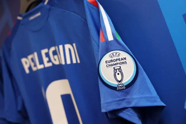 DORTMUND, GERMANY - JUNE 15: A UEFA European Champions 2020 emblem is seen on the shirt sleeve of Lorenzo Pellegrini inside the Italy dressing room prior to the UEFA EURO 2024 group stage match between Italy and Albania at Football Stadium Dortmund on June 15, 2024 in Dortmund, Germany. (Photo by Claudio Villa/Getty Images for FIGC)