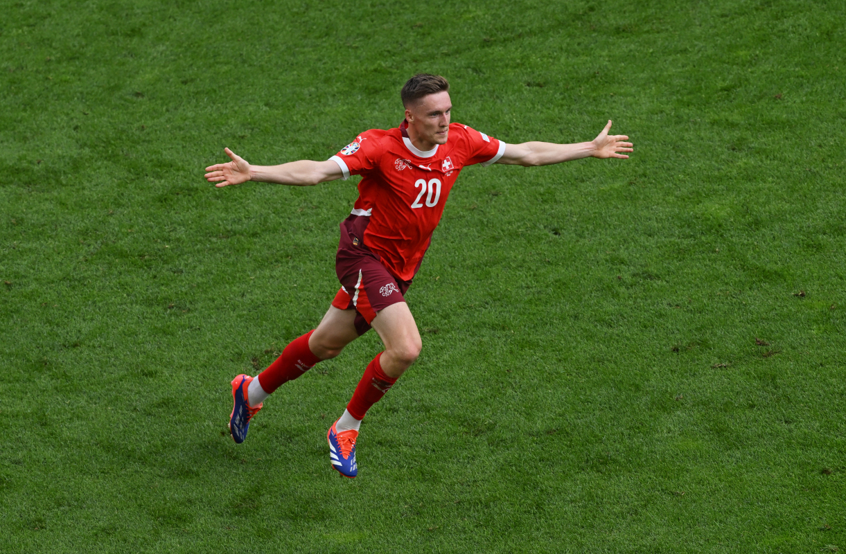 COLOGNE, GERMANY - JUNE 15: Michel Aebischer of Switzerland celebrates scoring his team's second goal during the UEFA EURO 2024 group stage match between Hungary and Switzerland at Cologne Stadium on June 15, 2024 in Cologne, Germany. (Photo by Stu Forster/Getty Images)