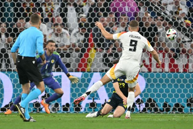 Germany's forward #09 Niclas Fuellkrug kicks and scores the fourth goal during the UEFA Euro 2024 Group A football match between Germany and Scotland at the Munich Football Arena in Munich on June 14, 2024. (Photo by MIGUEL MEDINA / AFP) (Photo by MIGUEL MEDINA/AFP via Getty Images)