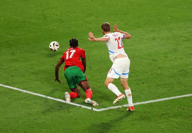 LEIPZIG, GERMANY - JUNE 18: Rafael Leao of Portugal dives to the floor whilst under pressure from Tomas Soucek of Czechia, which results in a yellow card for Rafael Leao, during the UEFA EURO 2024 group stage match between Portugal and Czechia at Football Stadium Leipzig on June 18, 2024 in Leipzig, Germany. (Photo by Julian Finney/Getty Images)