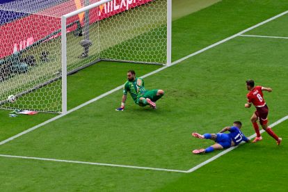 Switzerland's midfielder #08 Remo Freuler (R) kicks the ball to score his team's first goal against Italy's goalkeeper #01 Gianluigi Donnarumma (L) during the UEFA Euro 2024 round of 16 football match between Switzerland and Italy at the Olympiastadion Berlin in Berlin on June 29, 2024. (Photo by JOHN MACDOUGALL / AFP) (Photo by JOHN MACDOUGALL/AFP via Getty Images)