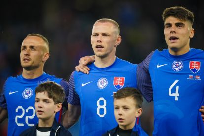 BRATISLAVA, SLOVAKIA - MARCH 23: Stanislav Lobotka, Ondrej Duda and Adam Obert (L-R) of Slovakia stand for the national anthem prior to the international friendly match between Slovakia and Austria at National Football stadium on March 23, 2024 in Bratislava, Slovakia. (Photo by Christian Hofer/Getty Images)