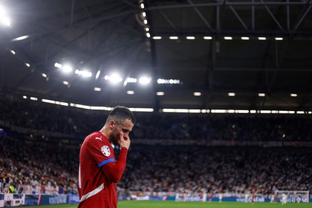 Serbia forward Filip Kostic goes off after sustaining an injury during the UEFA Euro 2024 Group C football match between Serbia and England at the Arena AufSchalke in Gelsenkirchen on June 16, 2024. (Photo by Kenzo TRIBOUILLARD / AFP) (Photo by KENZO TRIBOUILLARD/AFP via Getty Images)