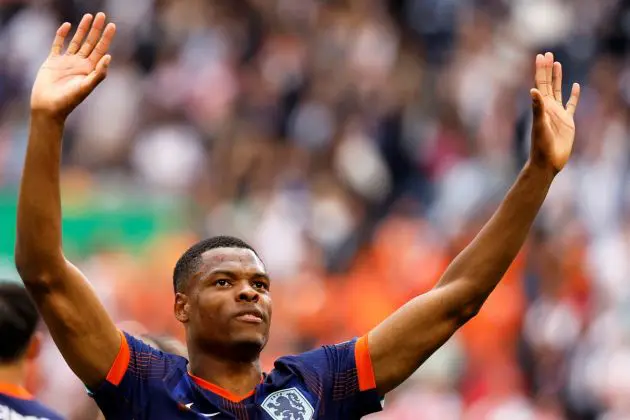 #22 Denzel Dumfries of Serie A side Inter and the Netherlands national team celebrates after winning the UEFA Euro 2024 Group D football match between Poland and the Netherlands at the Volksparkstadion in Hamburg on June 16, 2024. (Photo by Odd ANDERSEN / AFP) (Photo by ODD ANDERSEN/AFP via Getty Images)