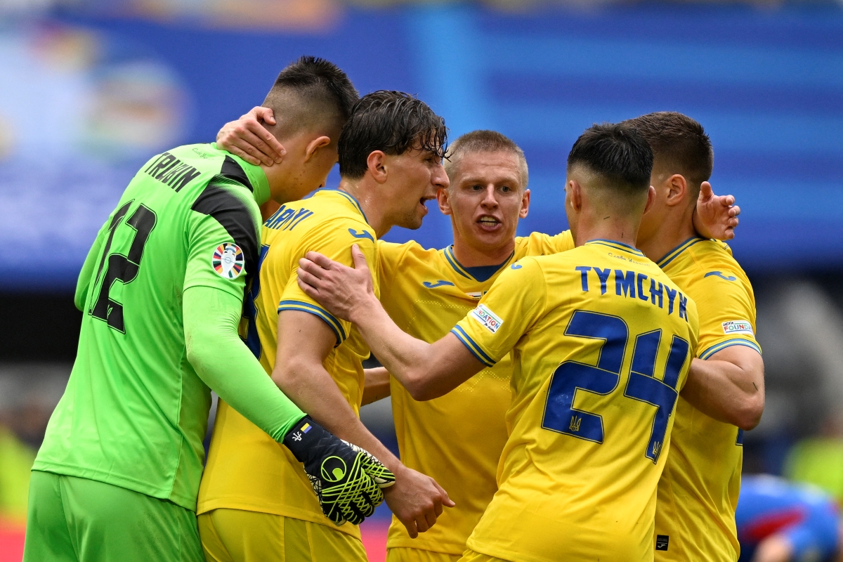 Ukraine players including defender Oleksandr Zinchenko celebrating