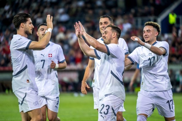 Switzerland midfielder Xherdan Shaqiri (C-R) celebrates with Switzerland's defender #18 Leonidas Stergiou (L), Switzerland's forward #07 Zeki Amdouni (2L), Switzerland's midfielder Vincent Sierro #06 (BACK) and Switzerland's midfielder #17 Ruben Vargas after scoring his team's fourth goal during the international friendly football match between Switzerland and Estonia at the Swissporarena Stadium, in Lucerne, central Switzerland, on June 4, 2024. (Photo by Fabrice COFFRINI / AFP) (Photo by FABRICE COFFRINI/AFP via Getty Images)