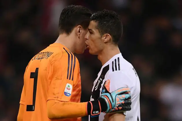 Juventus forward Cristiano Ronaldo (R) speaks to Juventus goalkeeper Wojciech Szczesny before a penalty for AC Milan during the Italian Serie A football match AC Milan vs Juventus on November 11, 2018 at the San Siro stadium in Milan. (Photo by Marco BERTORELLO / AFP) (Photo credit should read MARCO BERTORELLO/AFP via Getty Images)