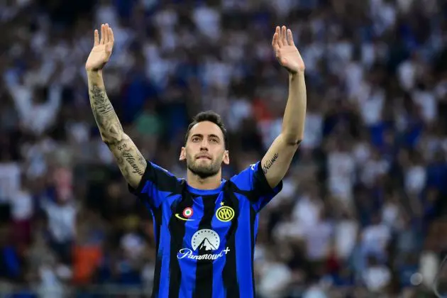 Inter Milan midfielder Hakan Calhanoglu waves during a ceremony for the Italian Champions following the Italian Serie A football match between Inter Milan and Lazio in Milan, on May 19, 2024. Inter celebrates his 20th Scudetto. (Photo by Marco BERTORELLO / AFP) (Photo by MARCO BERTORELLO/AFP via Getty Images)