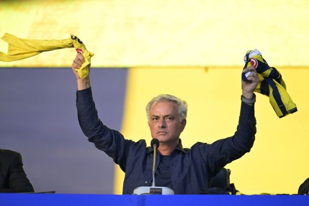 New coach of Turkish club Fenerbahce Jose Mourinho holds the jerseys of the club during the presentation to the supporters at the Sukru Saracoglu Stadium in Istanbul on June 2, 2024. Two-time Champions League winning Jose Mourinho will be the new coach of Turkish club Fenerbahce, he announced on June 1. The Portuguese coach, who won the Champions League with Porto and Inter Milan, has not worked since he was sacked by Italian Serie A side Roma in January 2024. (Photo by Yasin AKGUL / AFP) (Photo by YASIN AKGUL/AFP via Getty Images)