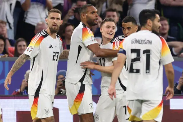 MUNICH, GERMANY - JUNE 14: Florian Wirtz of Germany celebrates with teammates after scoring his team's first goal during the UEFA EURO 2024 group stage match between Germany and Scotland at Munich Football Arena on June 14, 2024 in Munich, Germany. (Photo by Alexander Hassenstein/Getty Images)