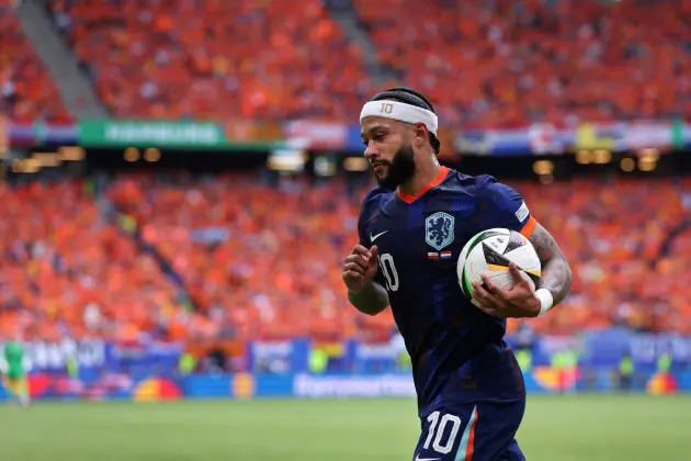 HAMBURG, GERMANY - JUNE 16: Memphis Depay of Netherlands carries the ball to take a corner kick during the UEFA EURO 2024 group stage match between Poland and Netherlands at Volksparkstadion on June 16, 2024 in Hamburg, Germany. (Photo by Alex Livesey/Getty Images)