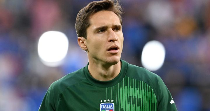 GELSENKIRCHEN, GERMANY - JUNE 20: Federico Chiesa of Italy looks on as he warms up prior to the UEFA EURO 2024 group stage match between Spain and Italy at Arena AufSchalke on June 20, 2024 in Gelsenkirchen, Germany. (Photo by Claudio Villa/Getty Images for FIGC)