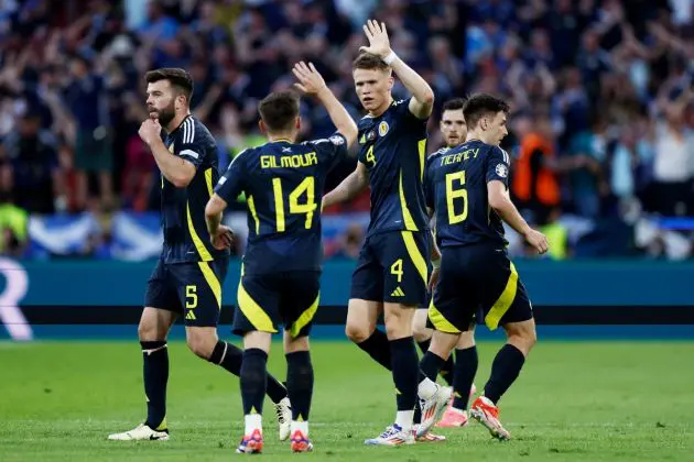 TOPSHOT - Scotland players celebrate the first goal the UEFA Euro 2024 Group A football match between Scotland and Switzerland at the Cologne Stadium in Cologne on June 19, 2024. (Photo by KENZO TRIBOUILLARD / AFP) (Photo by KENZO TRIBOUILLARD/AFP via Getty Images)